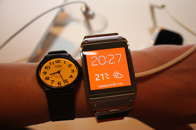 The Samsung Galaxy Gear sizing up next to a traditional wristwatch