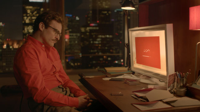 Joaquin Phoenix in the movie Her, where he forges a relationship with an artificially intelligent operating system. Abosch believes that his CHARLIE AI technology will bring technology like that seen in Her to life.