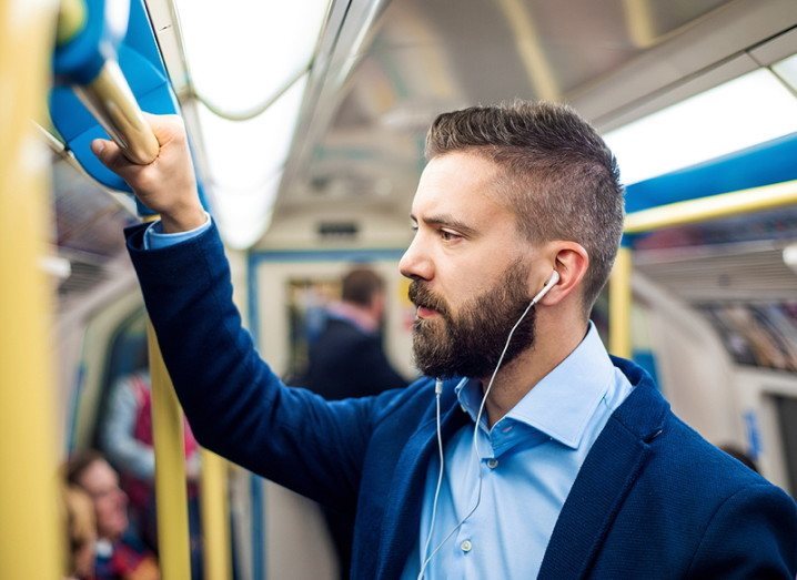 Commuting: commuter listening to music