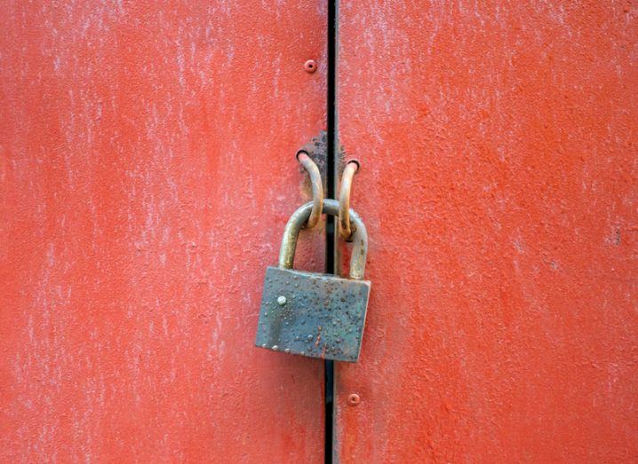 padlock on red door