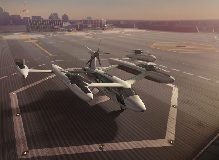 Artists rendering of an Uber flying taxi on a landing pad.