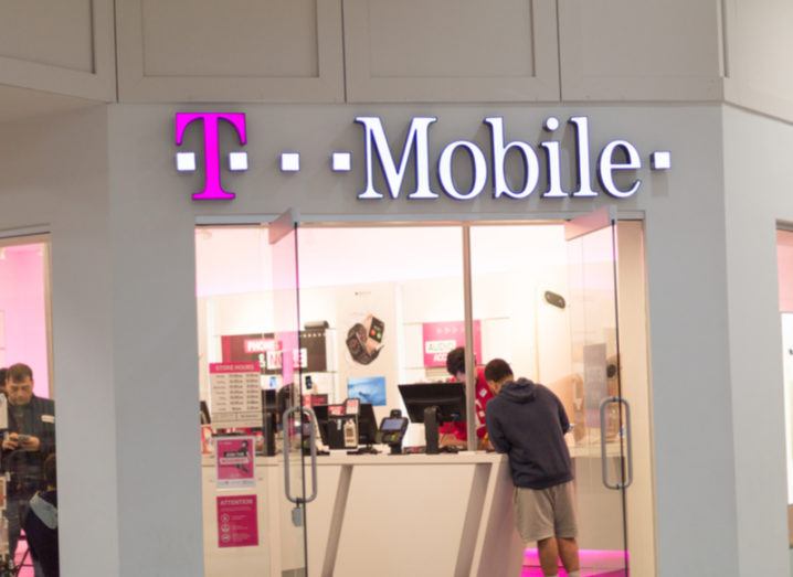 Exterior of a T-Mobile shop in Pennysylvania with customers perusing inside.