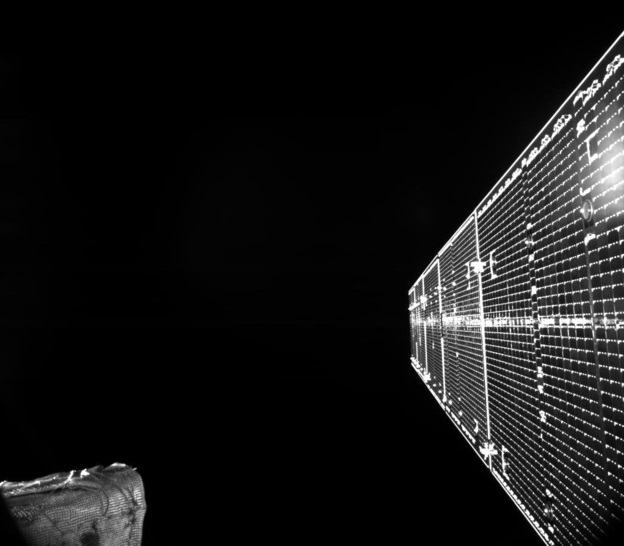 A black and white image of a BepiColombo solar array against the black of space.