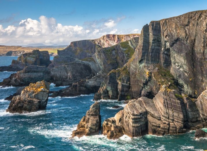 The coast of Mizen Head, Co Cork. Brightly lit cliff faces and deep blue water