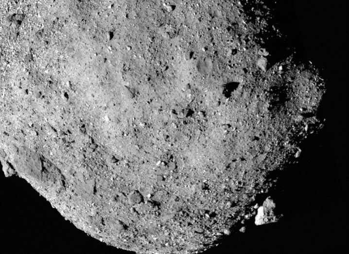 Close-up of the southern pole of the asteroid Bennu against a black background.