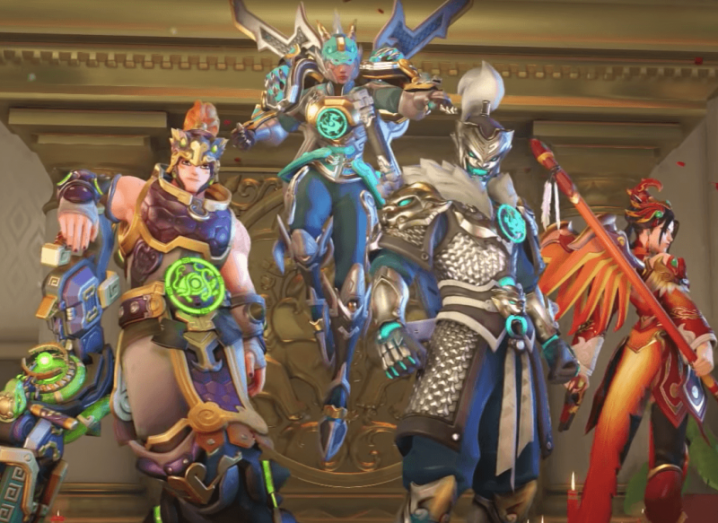 Characters from the Activision title Overwatch. They are wearing colourful battle armour.
