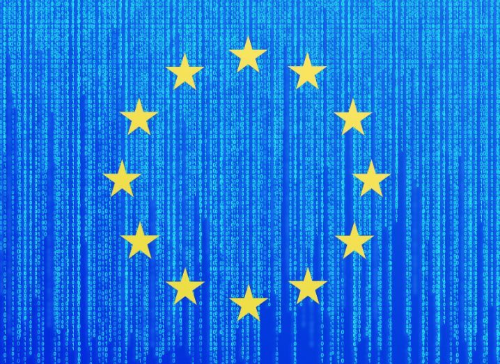 A circle of 12 gold stars on a blue background of lines of binary data, representing the European Union flag.