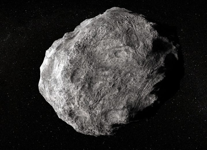 Illustration of a large asteroid drifting through space.