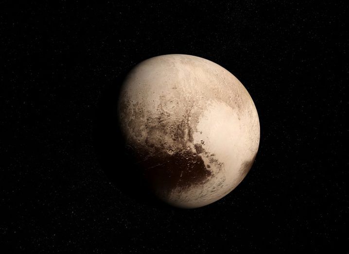 Pluto and its heart-shaped basin against a black background.