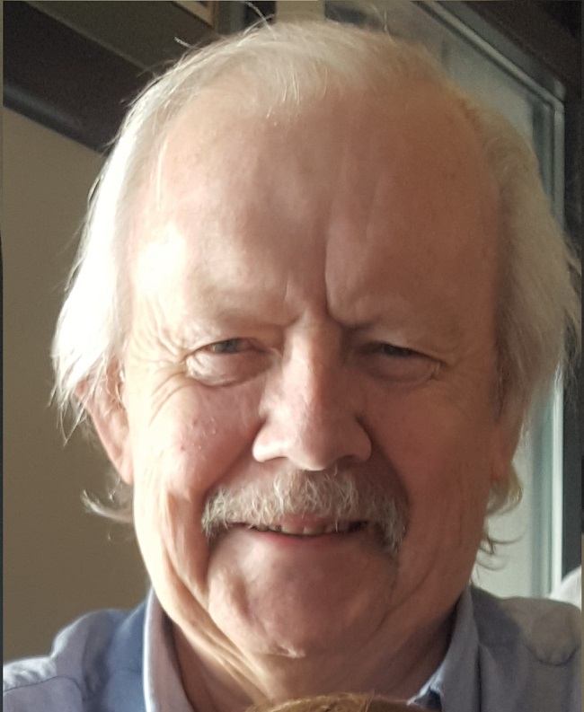 Headshot of Mike Tuthill smiling in 2017. 