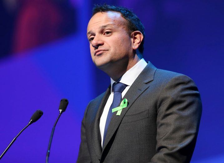 Leo Varadkar in a dark grey suit, white shirt and blue tie on stage at Inspirefest 2019.