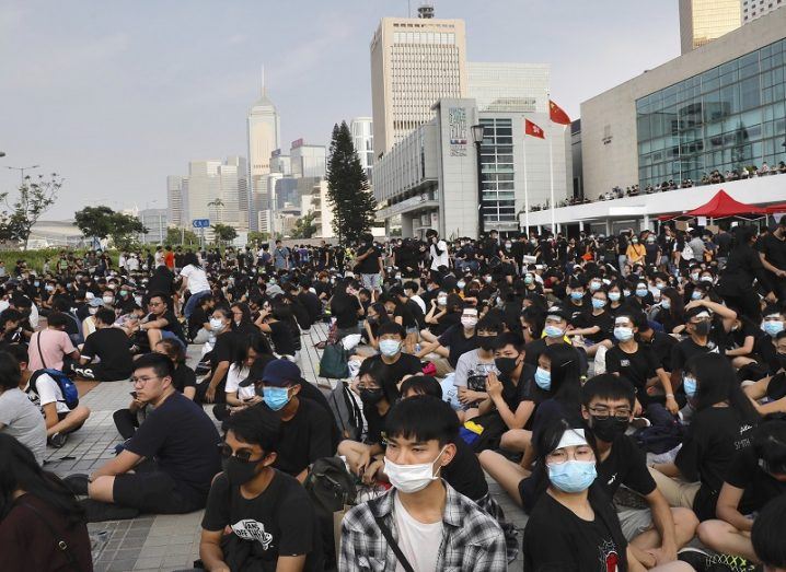 Large street protest in Hong Kong marching.