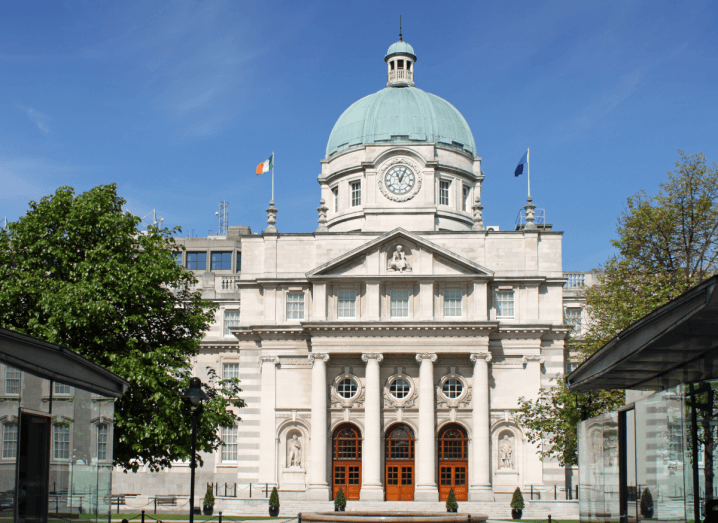 Leinster House, a large white building with a green dome on top of it.