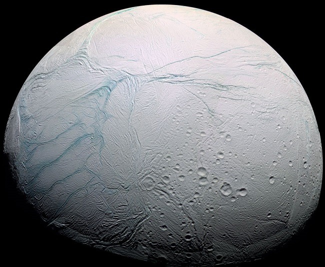 Orbital image of Enceladus with 'tiger stripe' fissures on its surface.