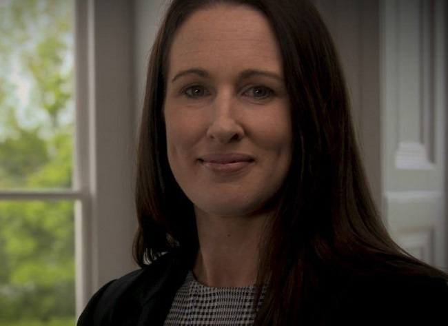 Headshot of Fiona McGillicuddy with a white window in the background.