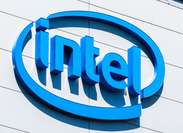 The blue Intel logo on the outside of a grey building.