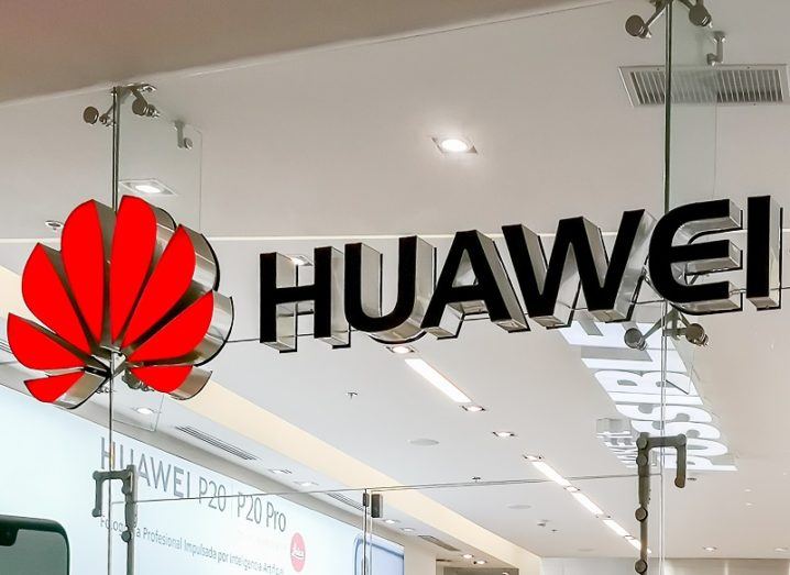 Huawei logo on a glass wall.