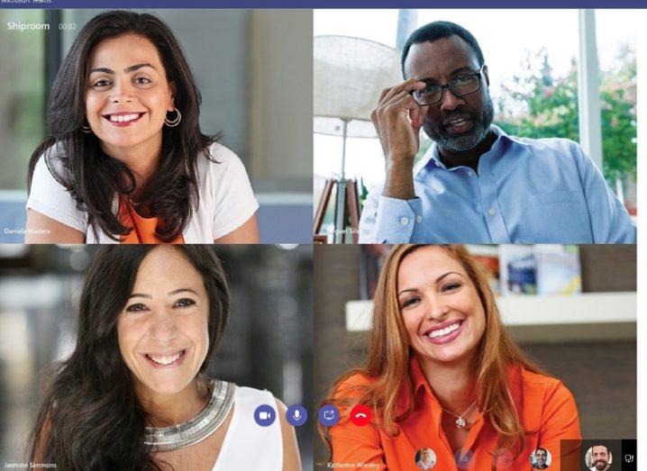 Four people smiling on webcam while using the Microsoft Teams tool.