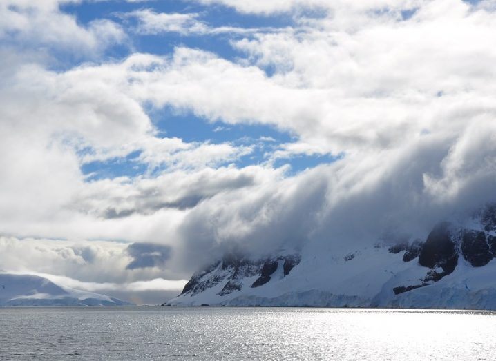 Clouds high above the coast of Antarctica as seen from the ocean.