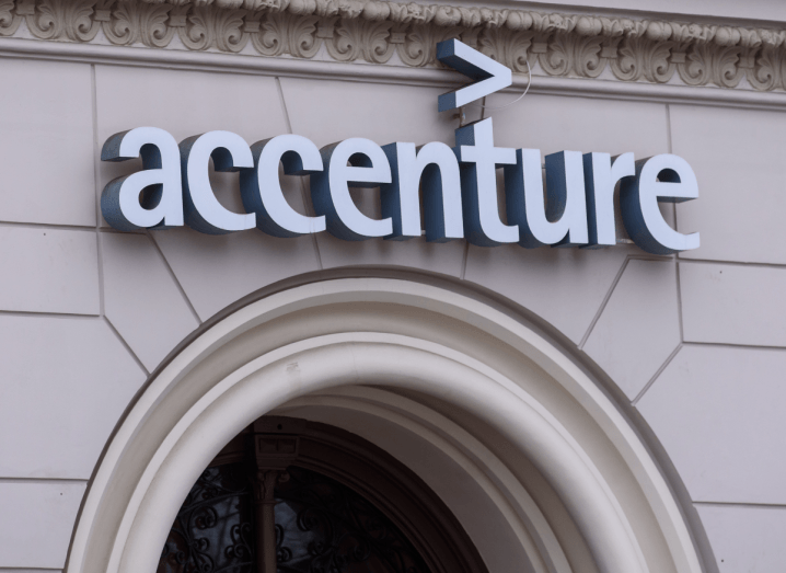 A beige brick building with the Accenture logo on the front of it.