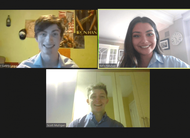 A young woman and two young men appear on a Zoom call.