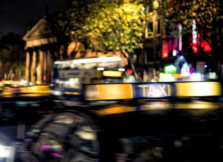 Dublin taxis on O'Connell Street at night.