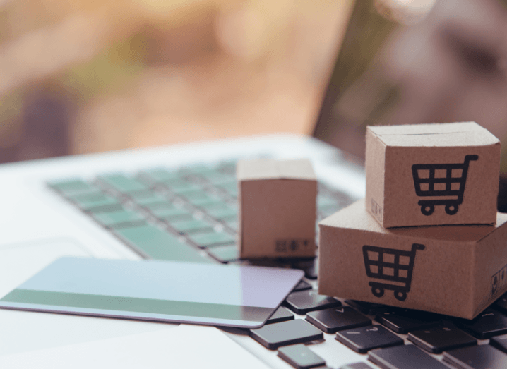 Small boxes and a payments card on the keyboard of a laptop.