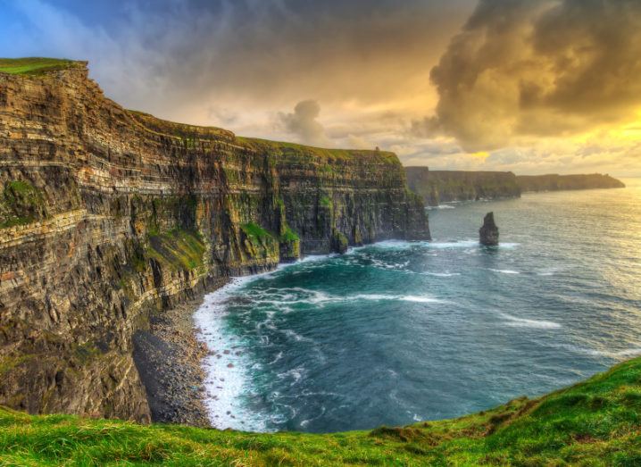 A beautiful landscape shot of the Cliffs of Moher at sunset.