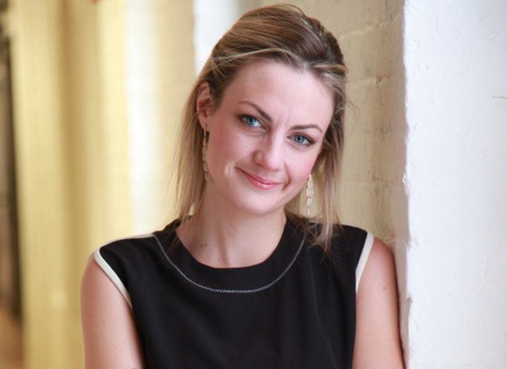 Headshot of Sinéad O'Sullivan smiling in a black top.