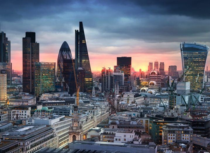 A view over the London city skyline at dusk.