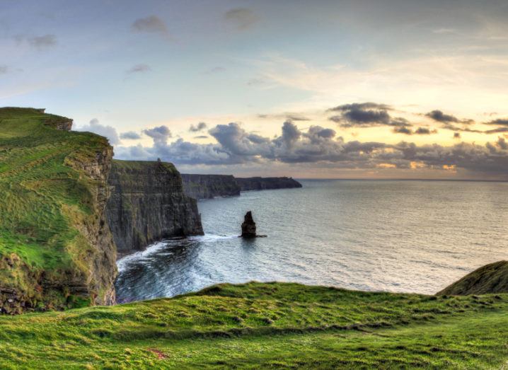 Panoramic view of the Cliffs of Moher at sunset in Ireland.