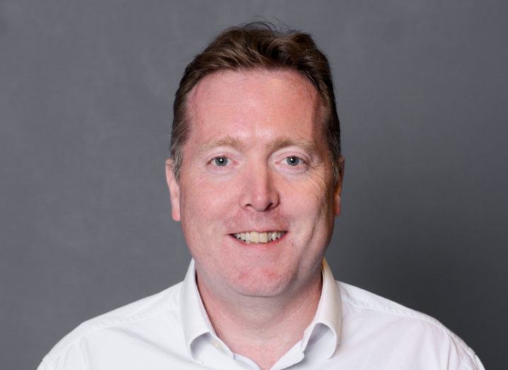 A headshot of Peter Ingram, CTO of Hastee. He’s wearing a shirt and smiling at the camera.