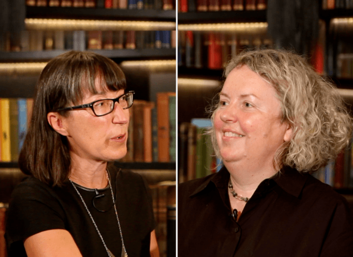 Ann O’Dea and Prof Linda Doyle in conversation in front of a well-stocked bookcase.