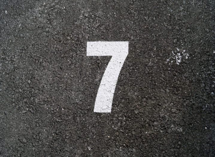 The number seven printed on a road.