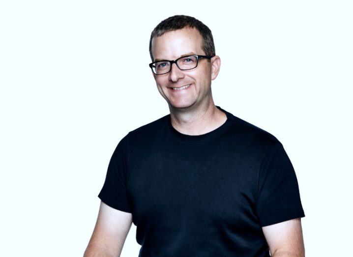 A headshot of outing CTO Mike Schroepfer in a black T-shirt against a white background.