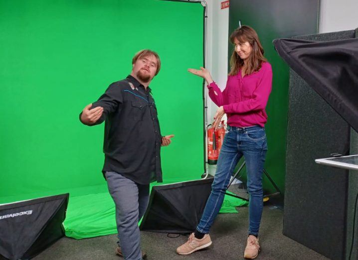 Fionn Angus and Dr Esther Murphy standing together with a green screen in the background.