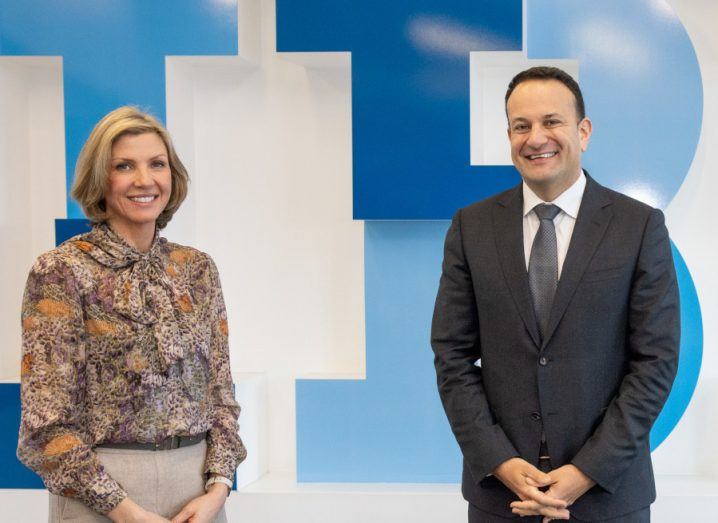 IBM's Deborah Threadgold and Leo Varadkar stand in front of a wall with the IBM logo in the background.