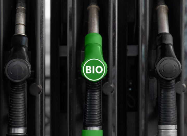 Renewable gas nozzle labelled 'bio' at a petrol station.