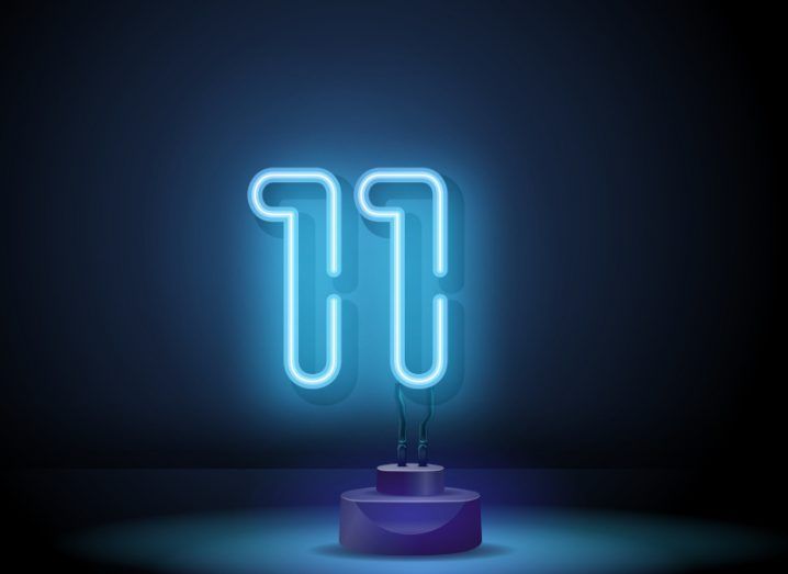 The number eleven in neon blue to signify the number of automation start-ups on the list.