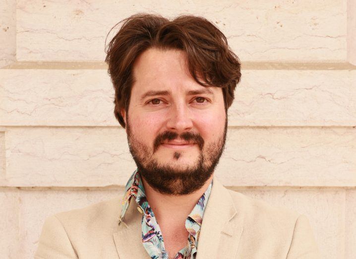 Headshot of Thibault Launay, founder and CEO of Doppl, wearing a cream coloured suit against a cream coloured wall in the background.