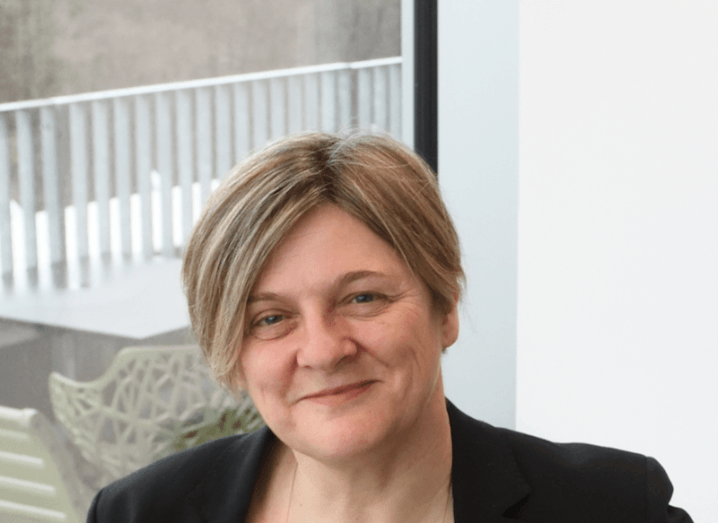 A headshot of Prof Wendy Bickmore. She has short, bobbed light brown hair, smiles at the camera and is sitting in front of a window.