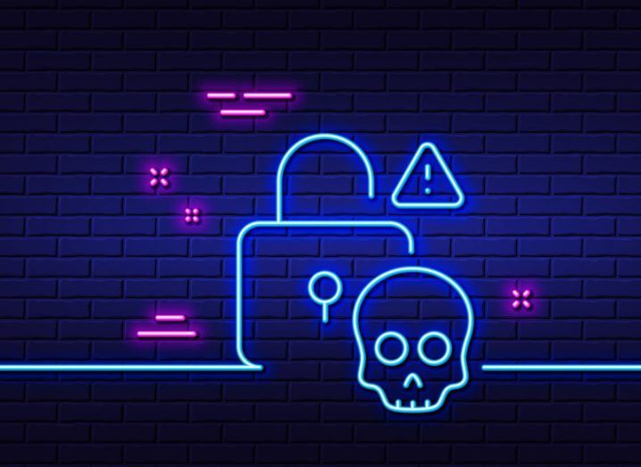 Illustration of a neon lock, a skull and a warning sign in front of a brick background. Used as a concept for cybersecurity and cyberattackers.