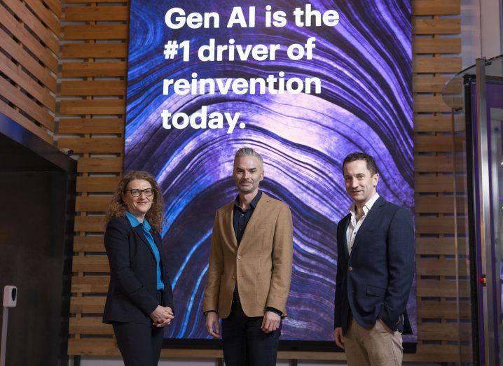 A woman and two men stand inside the Accenture Gen AI studio in Dublin.