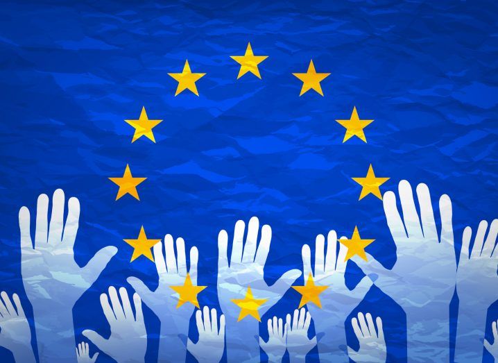 Illustration of hands held up high in an EU flag with a blue background and gold stars in the foreground.