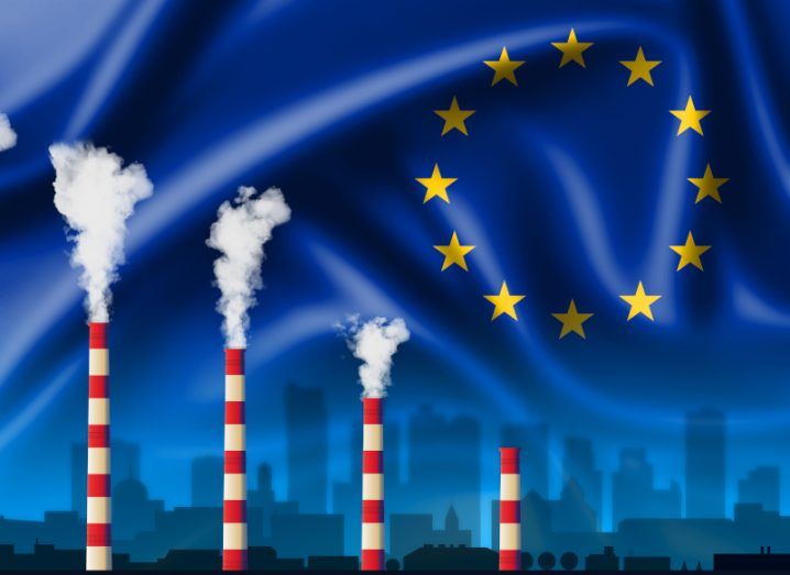 Four red and white striped chimney stacks going up in height and exhaling smoke in front of a wavy EU flag.