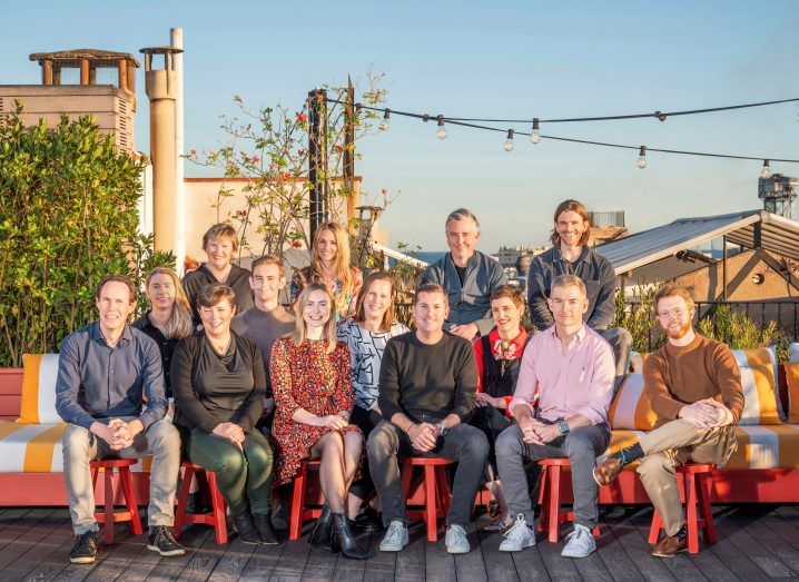 A group of people who work at Frontline Ventures sitting in the outdoors.