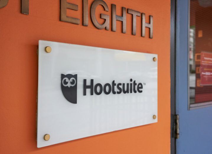 The Hootsuite logo on a sign on the front of a building.