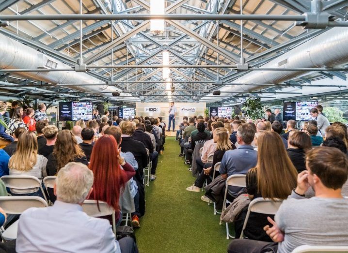 A crowd seated in Dogpatch Labs with an NDRC event taking place on the stage.