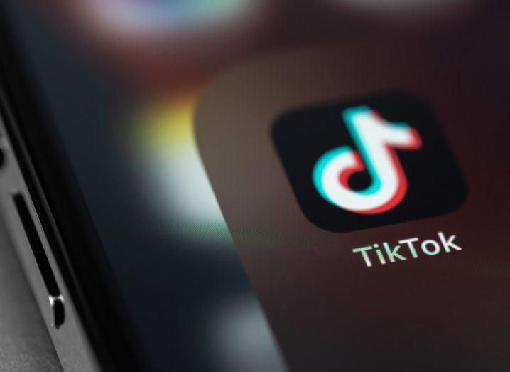 TikTok logo on a smartphone screen.