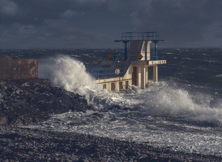 A diving rock in coastal Galway being battered by strong waves during a storm.